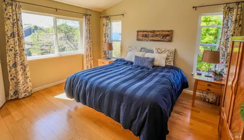 a bedroom with a bed and window