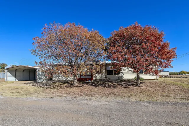 a house with trees in front of it
