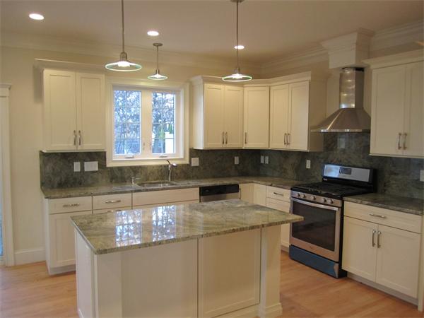 67 Hillcrest Road Waltham, MA 02451 - Photo 5 of 18 a kitchen with stainless steel appliances granite countertop a stove a sink and a granite counter tops
