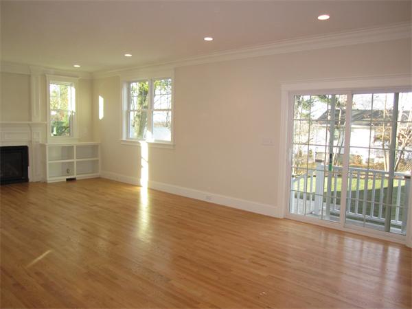 67 Hillcrest Road Waltham, MA 02451 - Photo 6 of 18 an empty room with wooden floor and windows