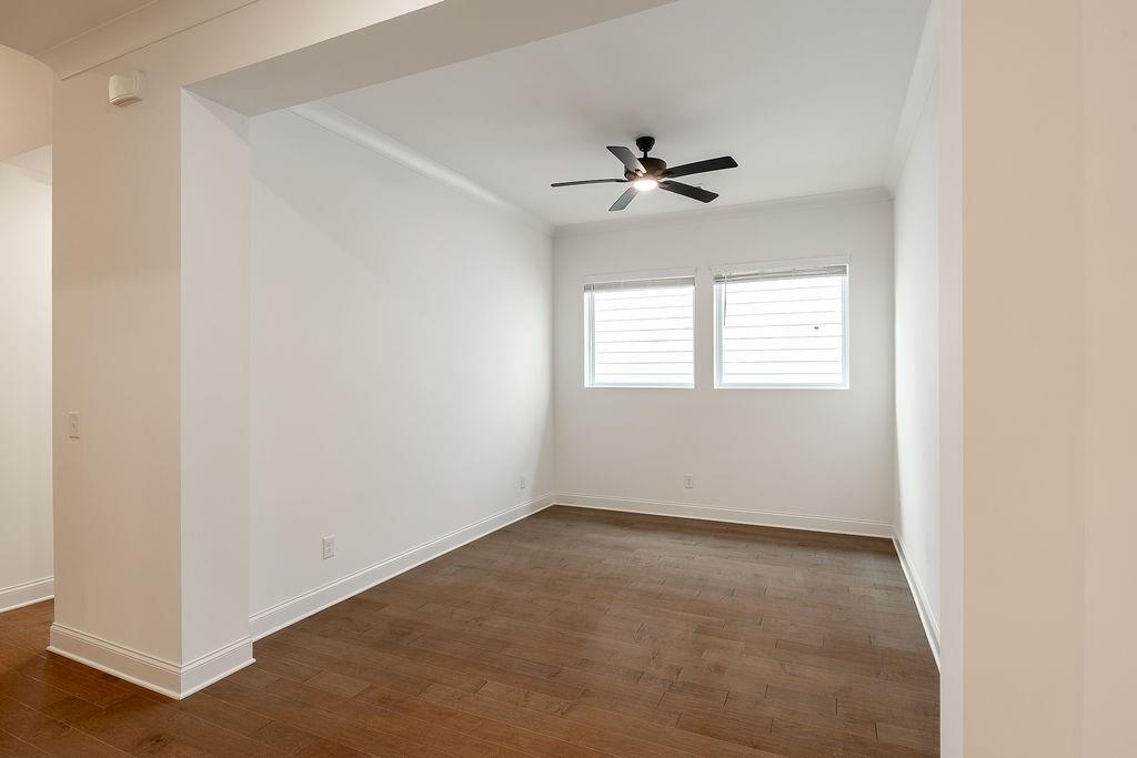 6954 Scenic Overlook Trace Flowery Branch, GA 30542 - Photo 13 of 55 a view of room with a ceiling fan and window