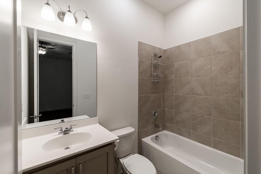 6954 Scenic Overlook Trace Flowery Branch, GA 30542 - Photo 36 of 55 a bathroom with a sink toilet and shower
