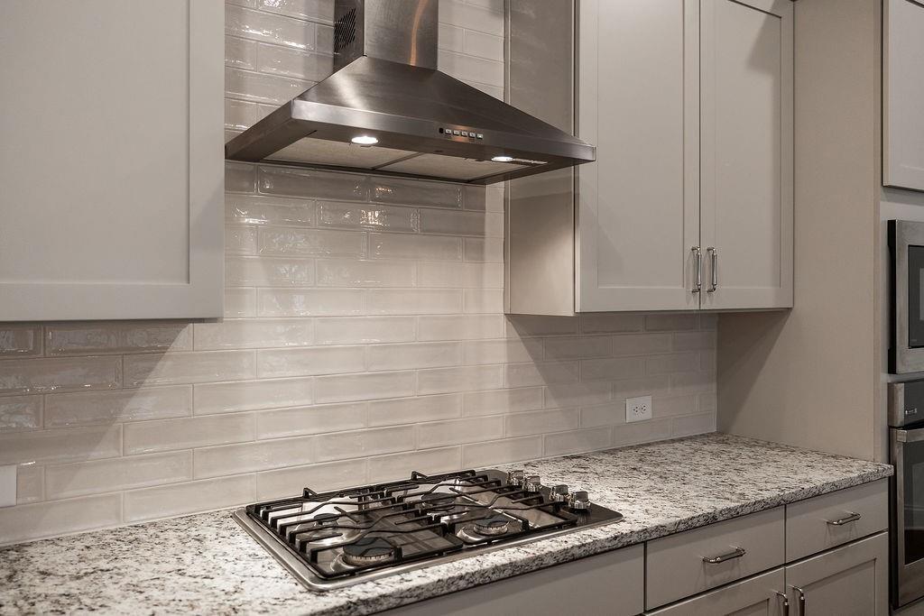6954 Scenic Overlook Trace Flowery Branch, GA 30542 - Photo 37 of 55 a stove top oven sitting inside of a kitchen