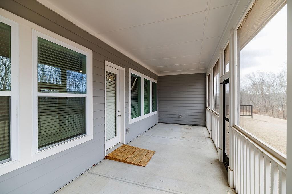 6954 Scenic Overlook Trace Flowery Branch, GA 30542 - Photo 42 of 55 a view of a balcony with large windows
