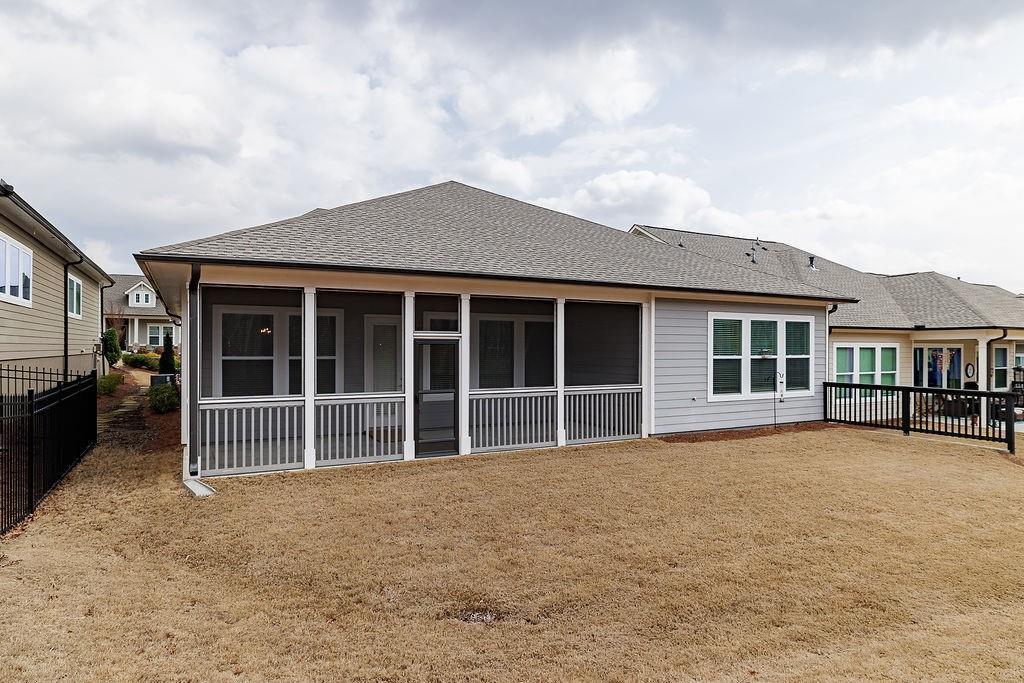 6954 Scenic Overlook Trace Flowery Branch, GA 30542 - Photo 44 of 55 a view of a house with a large window and balcony