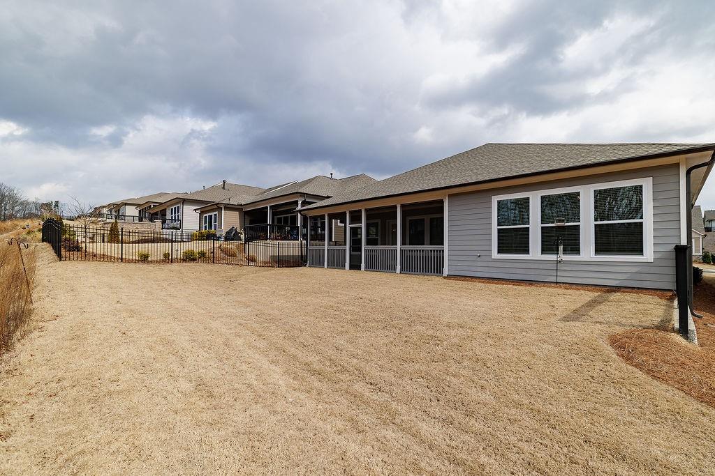 6954 Scenic Overlook Trace Flowery Branch, GA 30542 - Photo 45 of 55 a view of a house with a barbeque and wooden floor