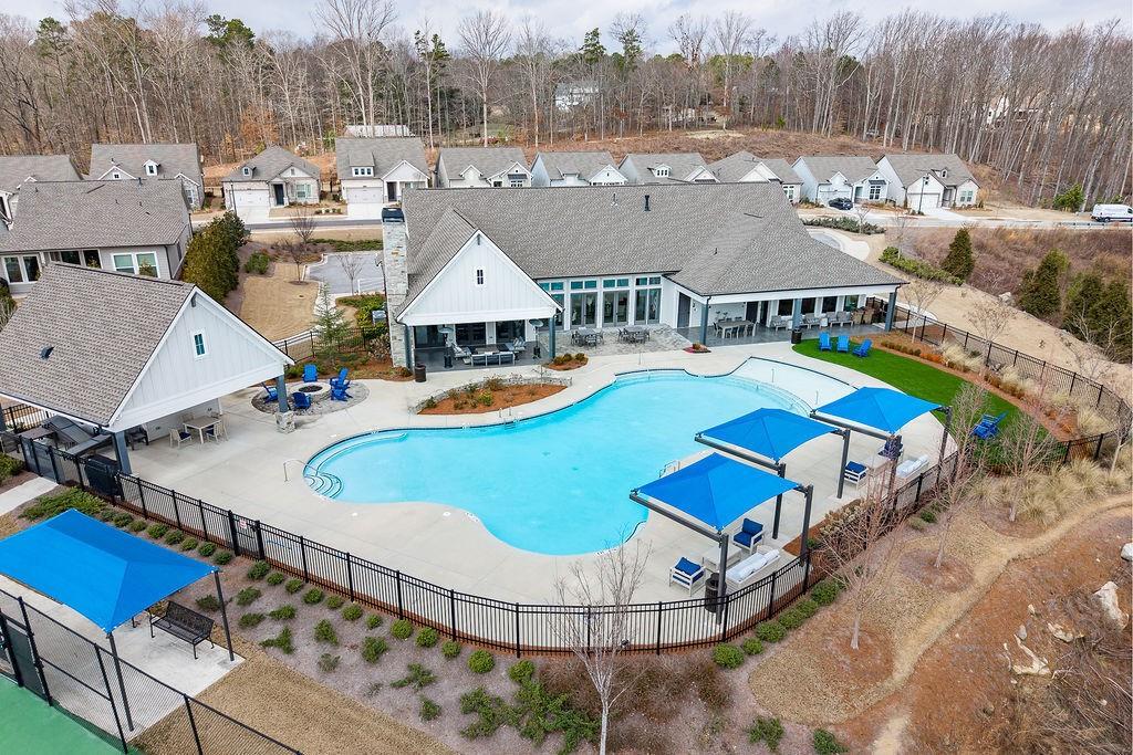 6954 Scenic Overlook Trace Flowery Branch, GA 30542 - Photo 53 of 55 a view of a house with pool and chairs
