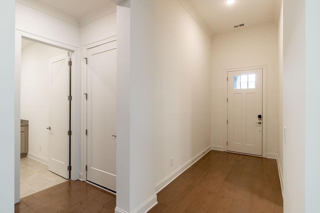 6954 Scenic Overlook Trace Flowery Branch, GA 30542 - Photo 7 of 55 a view of an empty room