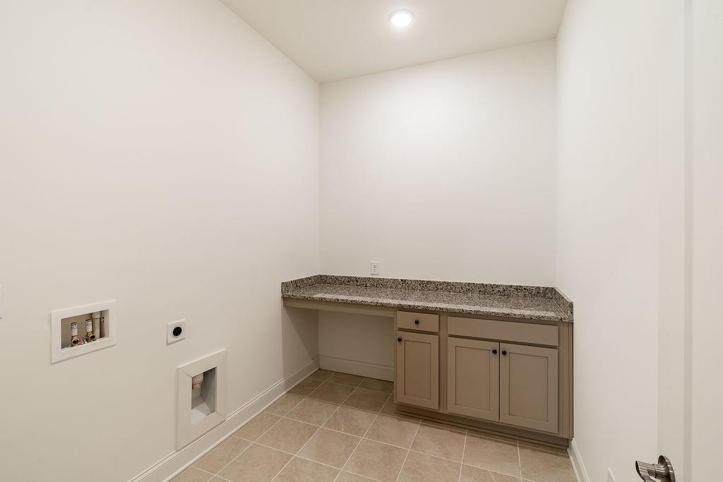 6954 Scenic Overlook Trace Flowery Branch, GA 30542 - Photo 9 of 55 a view of a kitchen with white cabinets