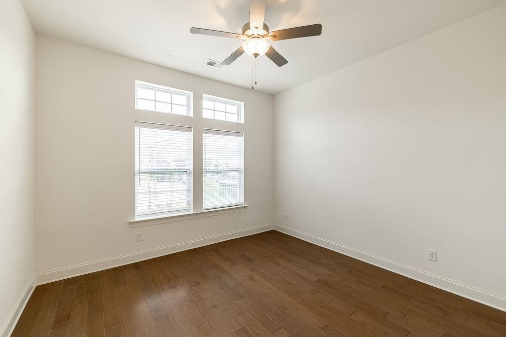 6954 Scenic Overlook Trace Flowery Branch, GA 30542 - Photo 10 of 55 an empty room with a window and a fan