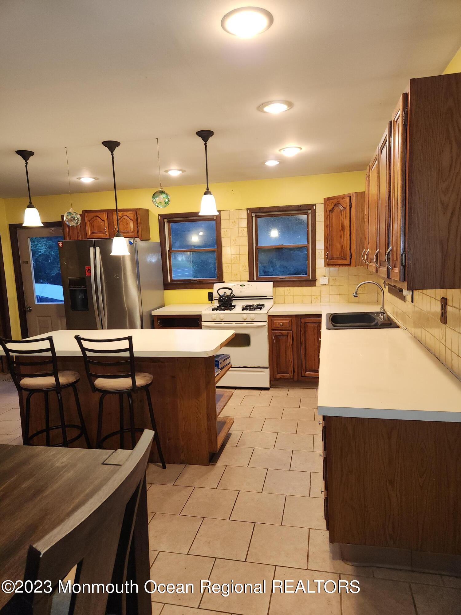 11 Main Street Cream Ridge, NJ 08514 - Photo 5 of 39 a kitchen with a table chairs and a view of living room
