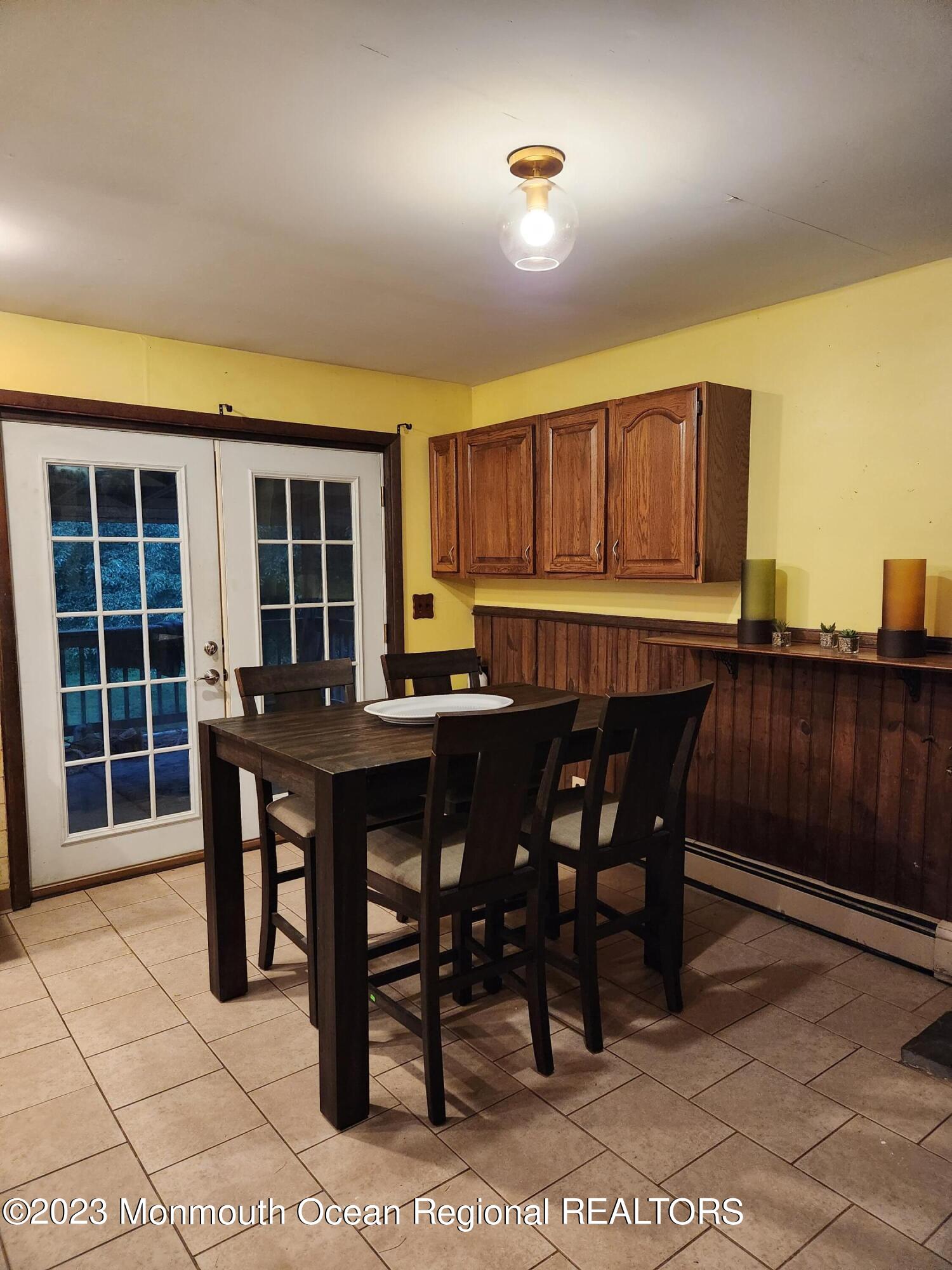 11 Main Street Cream Ridge, NJ 08514 - Photo 6 of 39 a view of a dining room with furniture and chandelier