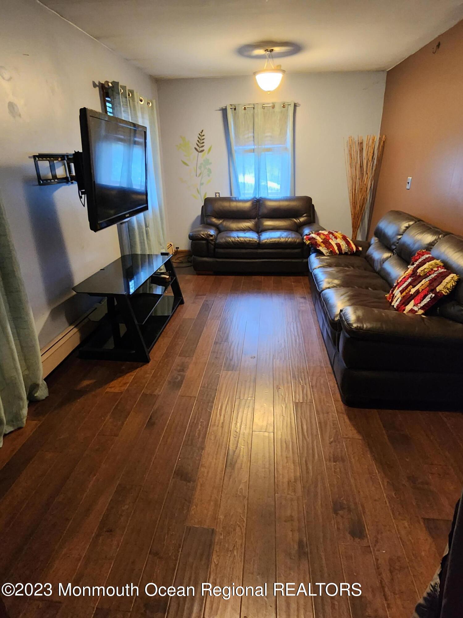 11 Main Street Cream Ridge, NJ 08514 - Photo 8 of 39 a living room with furniture and a wooden floor