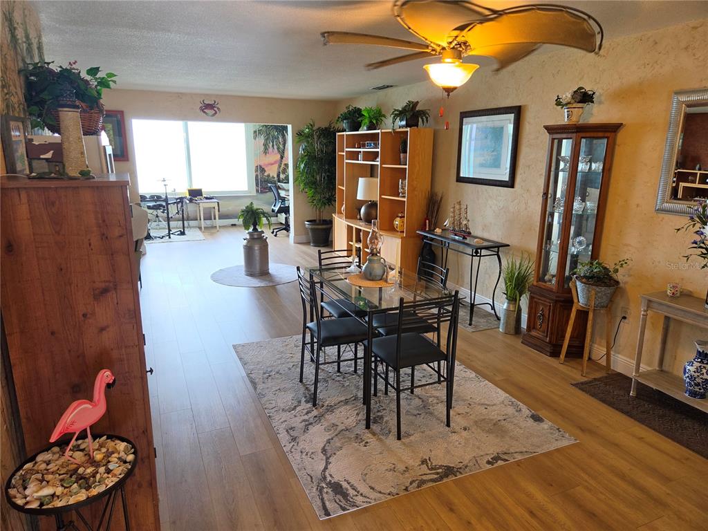 7 Dunoon Place, Unit 309 Dunedin, FL 34698 - Photo 3 of 25 a view of a livingroom with furniture and a wooden floor