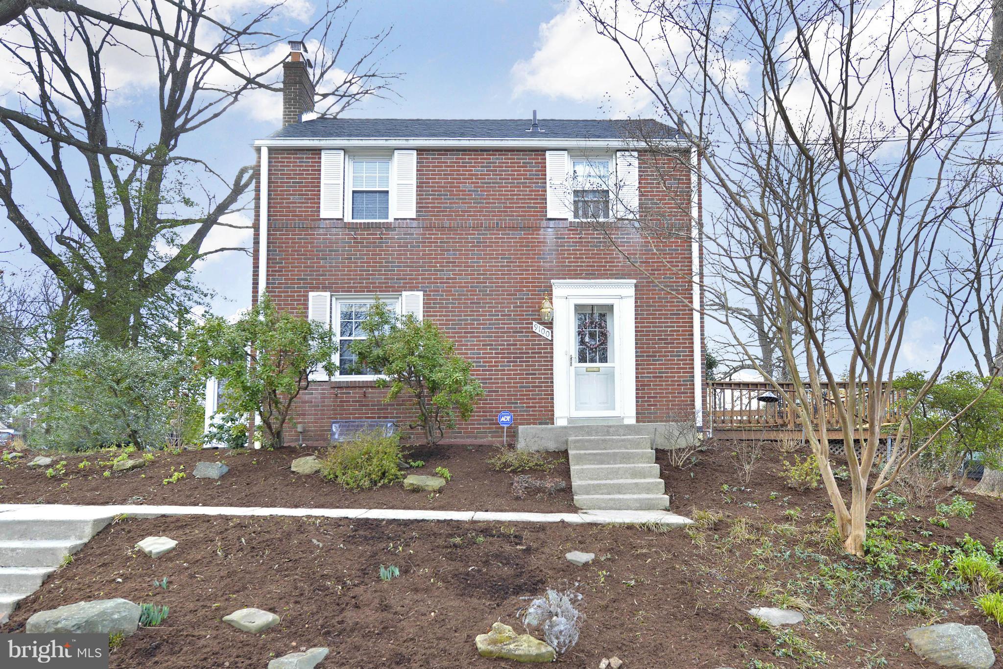 9100 Sudbury Road Silver Spring, MD 20901 - Photo 1 of 30 a front view of a house with a yard and garage