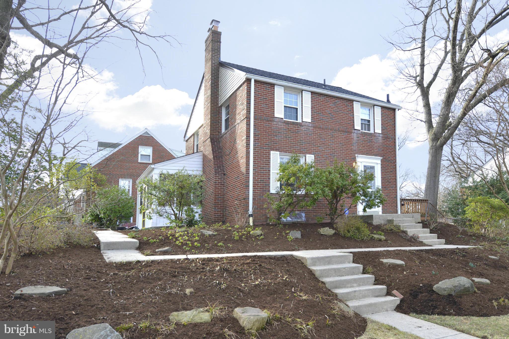 9100 Sudbury Road Silver Spring, MD 20901 - Photo 2 of 30 a front view of a house with a yard and potted plants