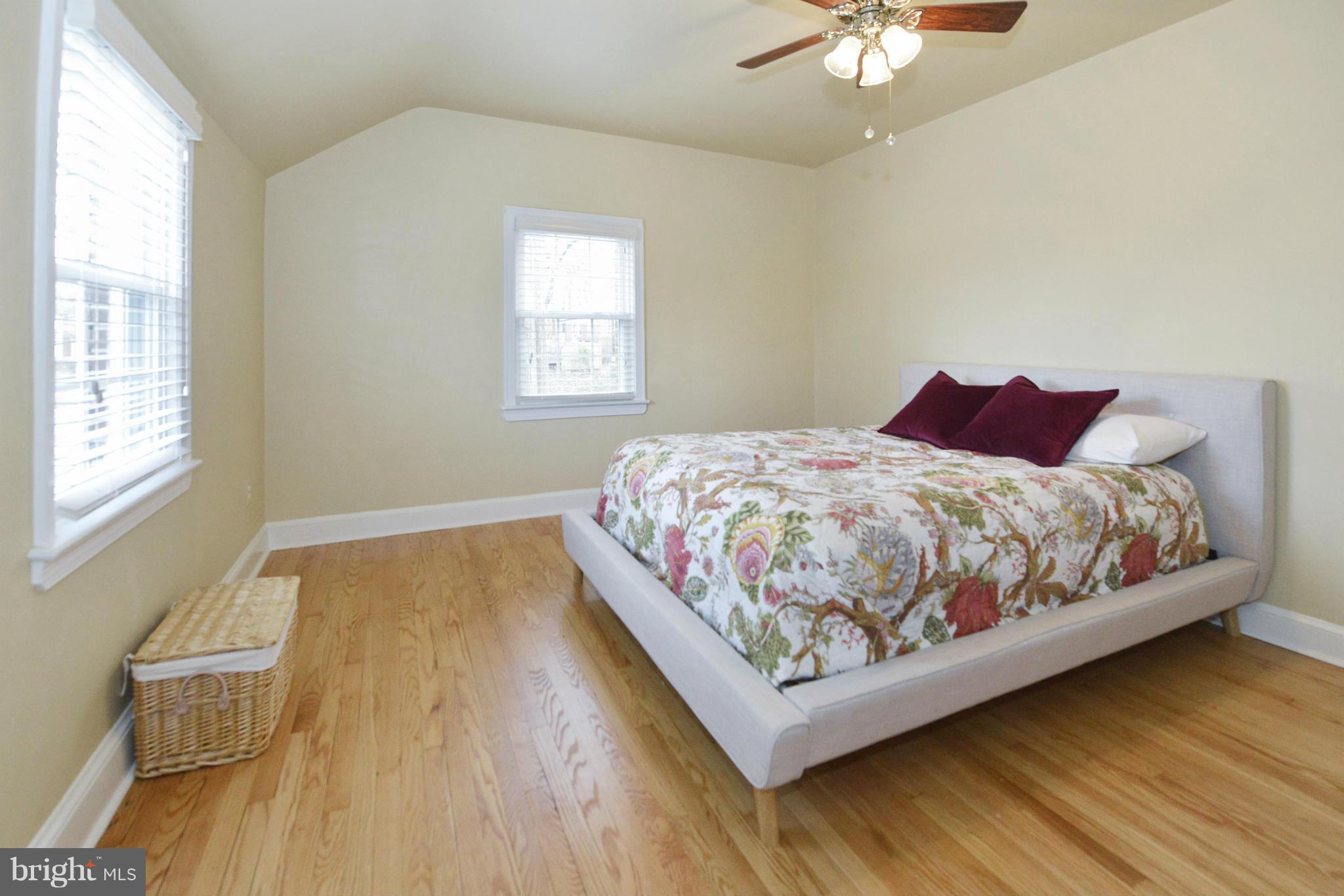 9100 Sudbury Road Silver Spring, MD 20901 - Photo 12 of 30 a bedroom with a bed and window