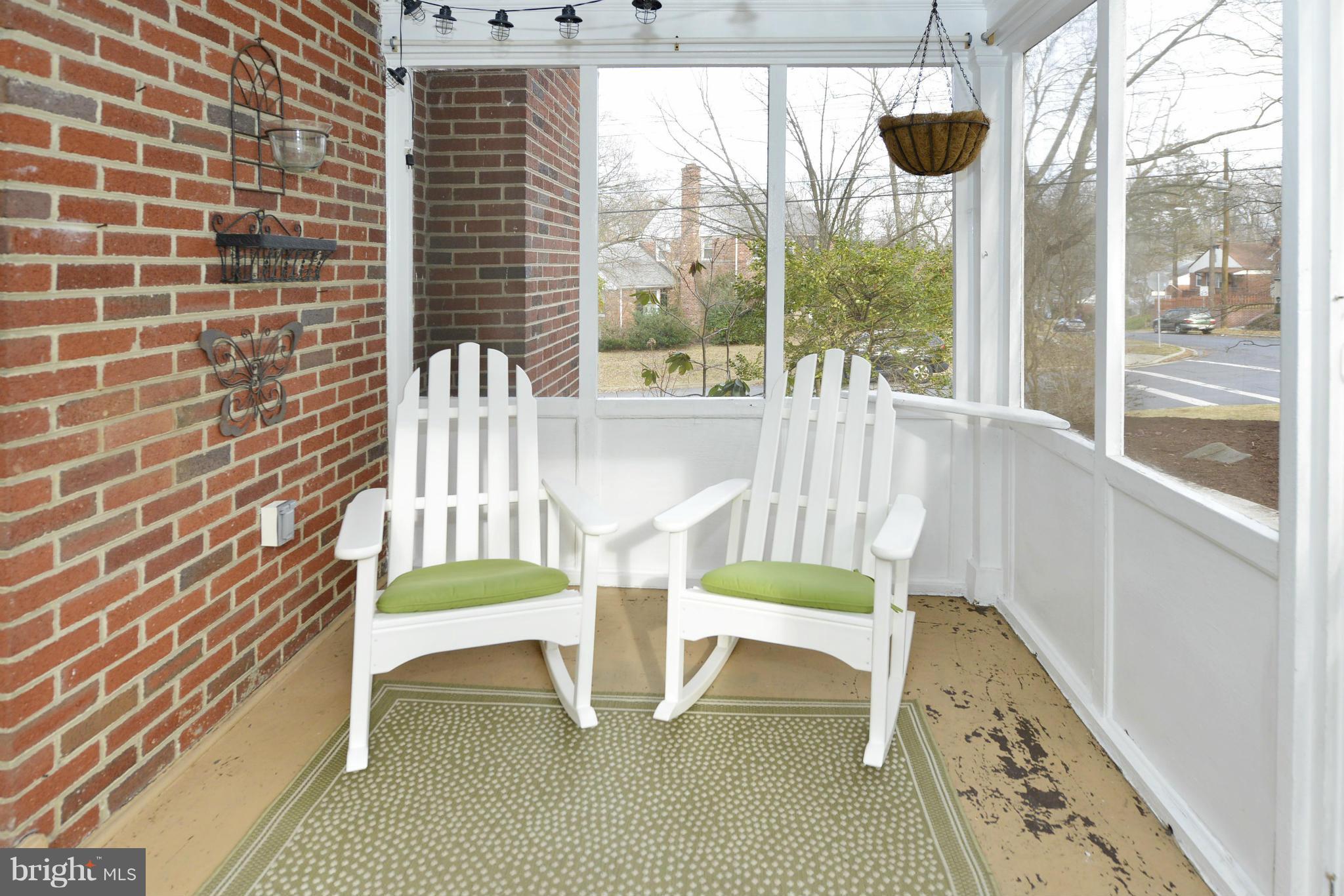 9100 Sudbury Road Silver Spring, MD 20901 - Photo 22 of 30 a chair and table sitting in front of a window