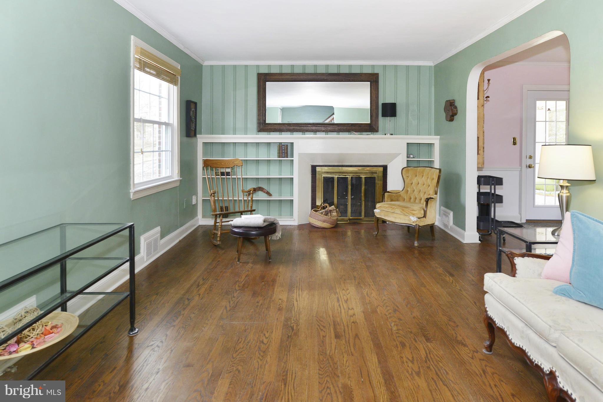 9100 Sudbury Road Silver Spring, MD 20901 - Photo 5 of 30 a living room with furniture and a fireplace