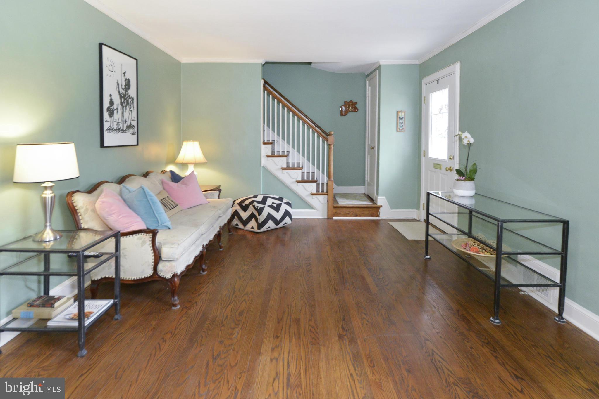 9100 Sudbury Road Silver Spring, MD 20901 - Photo 6 of 30 a living room with furniture and a wooden floor