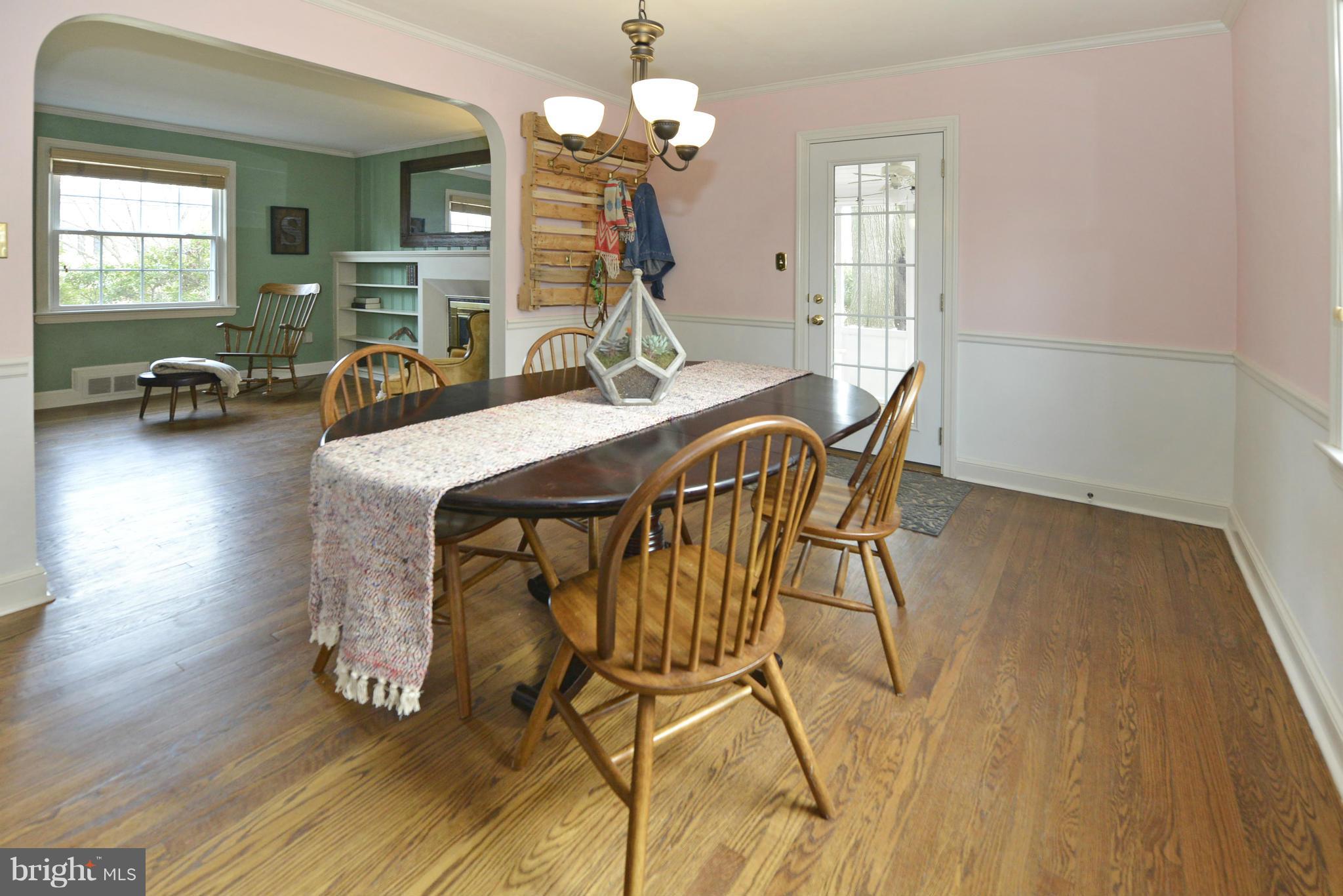 9100 Sudbury Road Silver Spring, MD 20901 - Photo 9 of 30 a view of a dining room with furniture and wooden floor