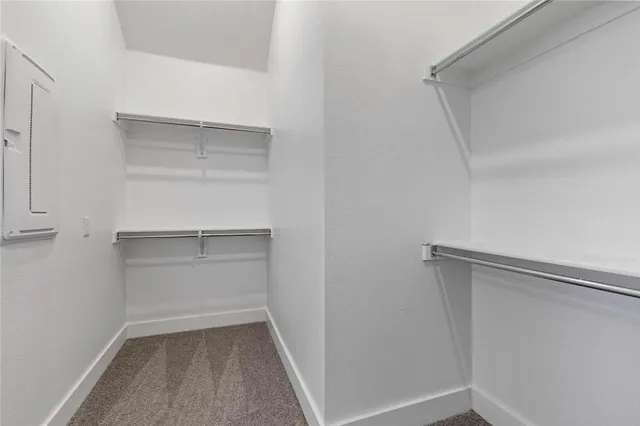 a view of an empty walk in closet