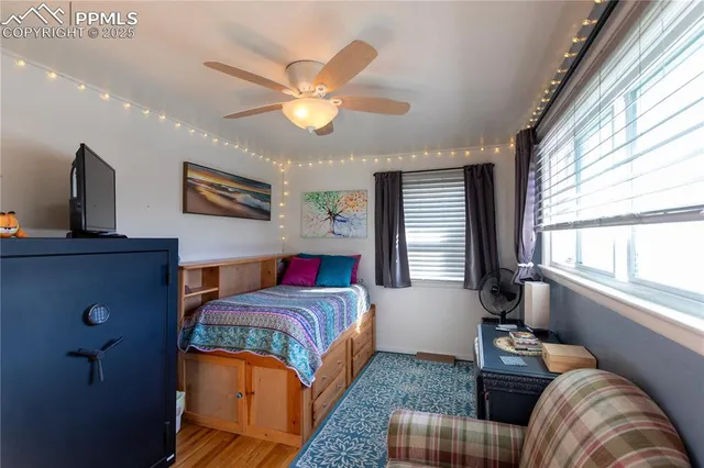 a bedroom with a large bed and a window