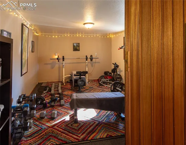 a bedroom with a bed and flat screen tv