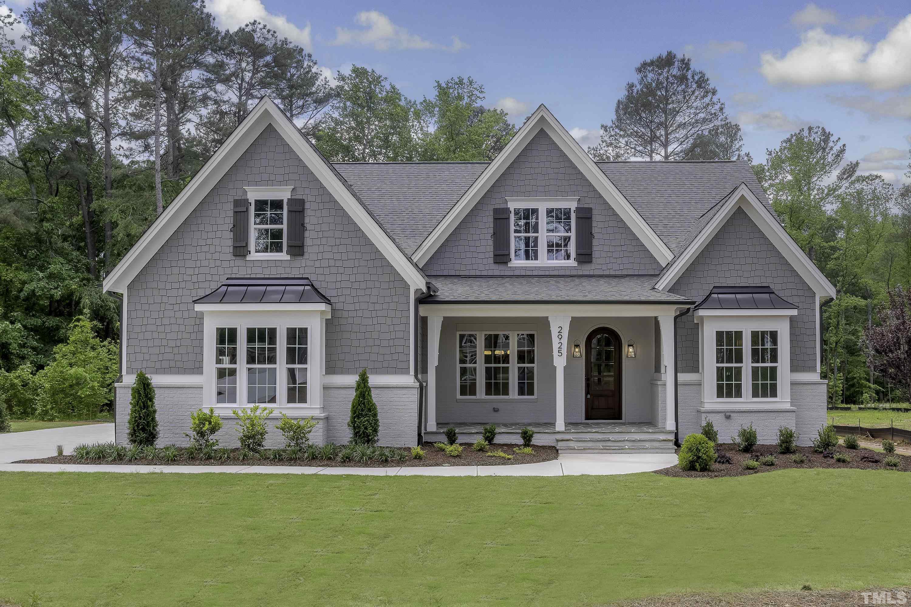 2925 Mt Vernon Church Road Raleigh, NC 27613 - Photo 1 of 25 a front view of a house with a yard