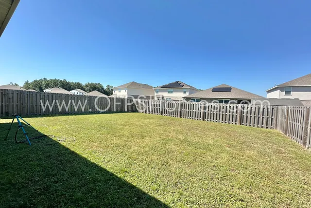 a view of front of house with swimming pool