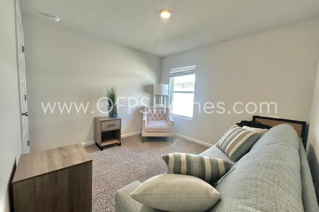 a bedroom with furniture and a couch