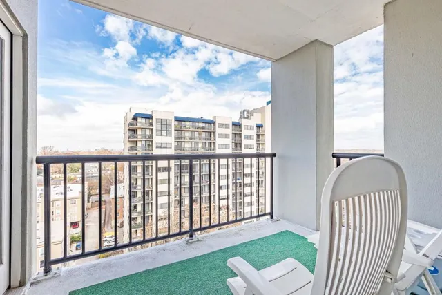 a view of a porch with a floor to ceiling window