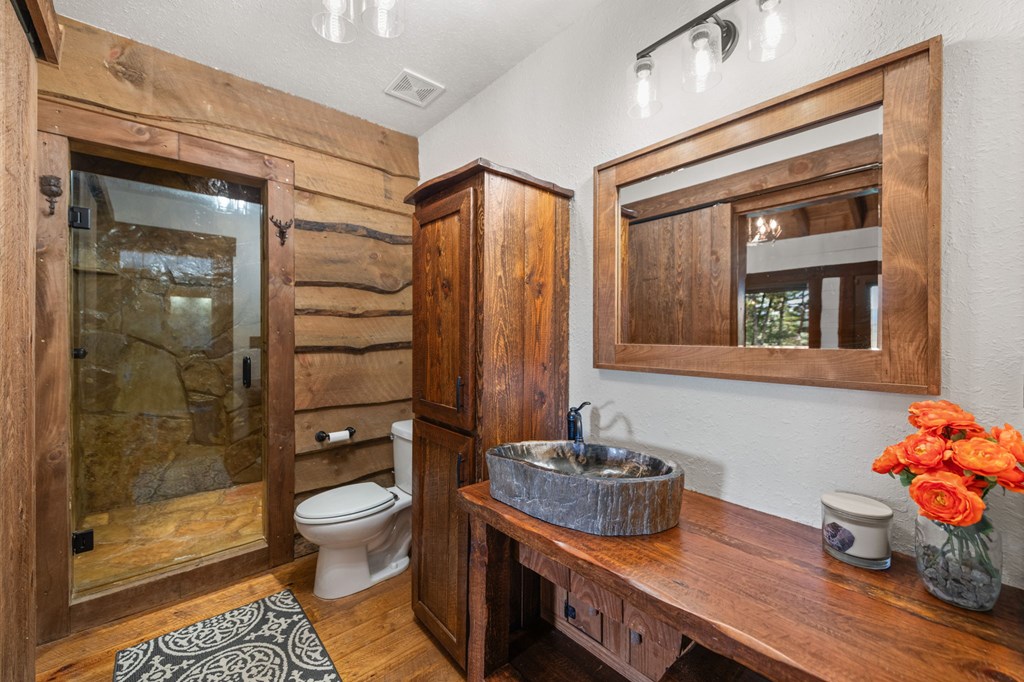 114 Price Circle Blue Ridge, GA 30513 - Photo 23 of 65 a bathroom with a sink a toilet and shower
