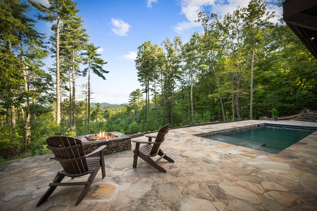 114 Price Circle Blue Ridge, GA 30513 - Photo 50 of 65 a view of swimming pool with lawn chairs and wooden fence
