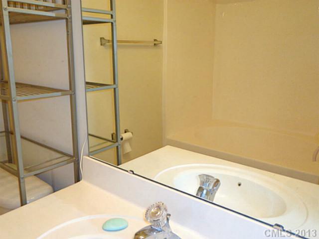 904 Copperstone Lane, Unit 182 Fort Mill, SC 29708 - Photo 11 of 14 a bathroom with a tub and sink