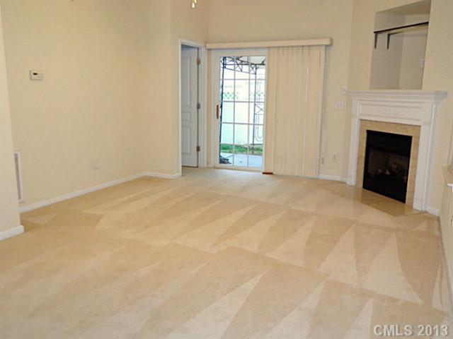 904 Copperstone Lane, Unit 182 Fort Mill, SC 29708 - Photo 4 of 14 a view of an empty room with window and fire place