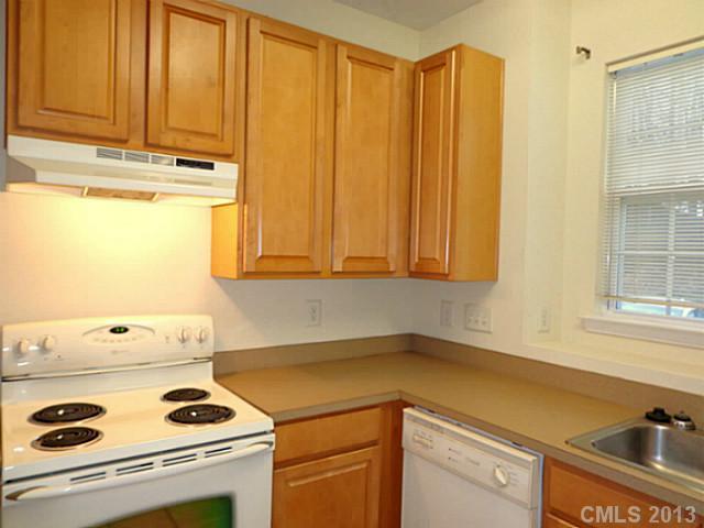 904 Copperstone Lane, Unit 182 Fort Mill, SC 29708 - Photo 7 of 14 a kitchen with a sink and cabinets