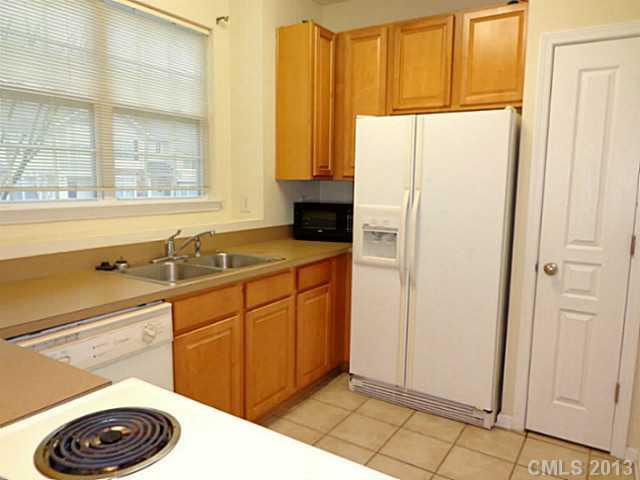 904 Copperstone Lane, Unit 182 Fort Mill, SC 29708 - Photo 8 of 14 a kitchen with a refrigerator and a sink