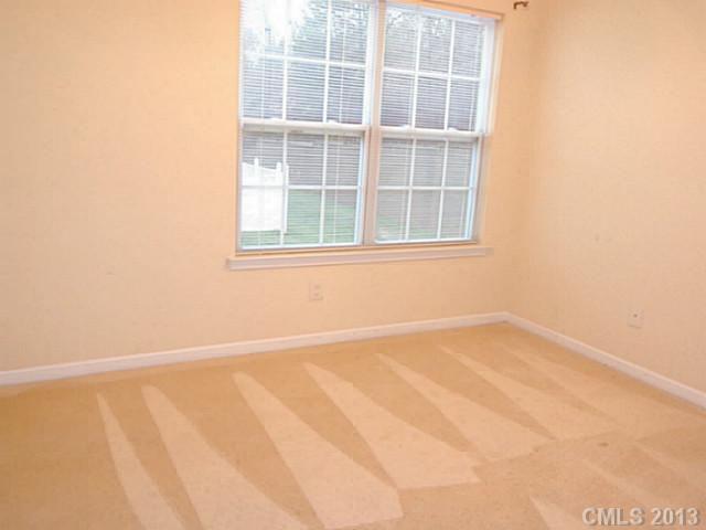 904 Copperstone Lane, Unit 182 Fort Mill, SC 29708 - Photo 9 of 14 a view of an empty room with a window