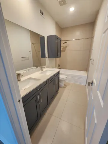 a bathroom with a sink a vanity and mirror