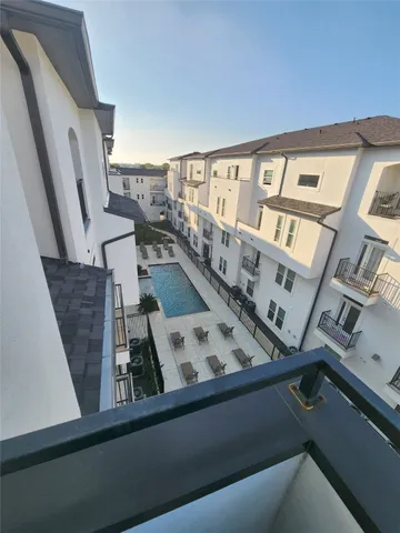 a view of roof deck with furniture