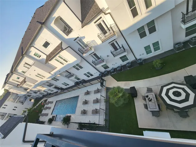 a kitchen with stainless steel appliances a stove a microwave and a sink