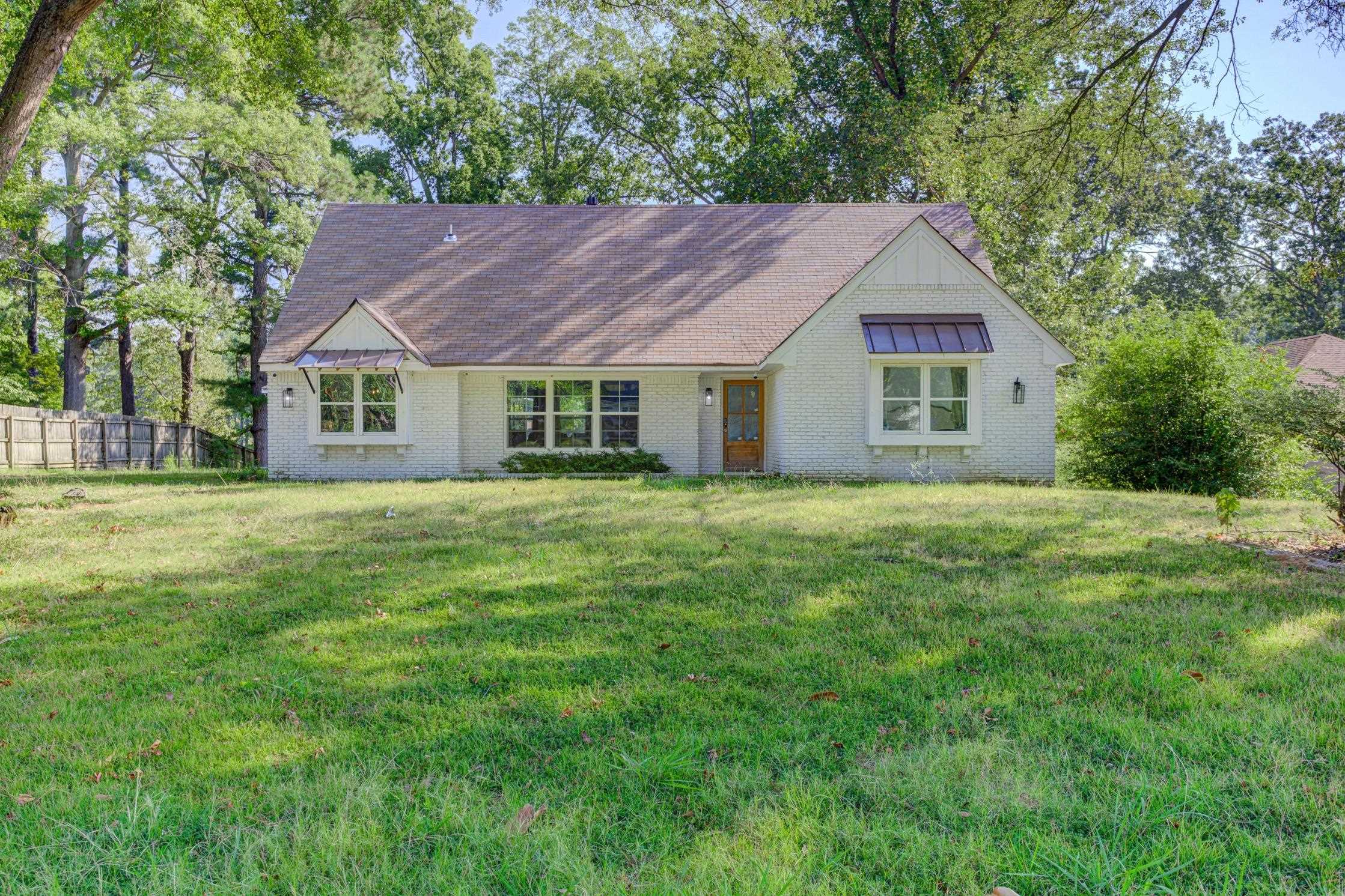 3914 Springfield Drive Memphis, TN 38128 - Photo 1 of 33 a house with a yard