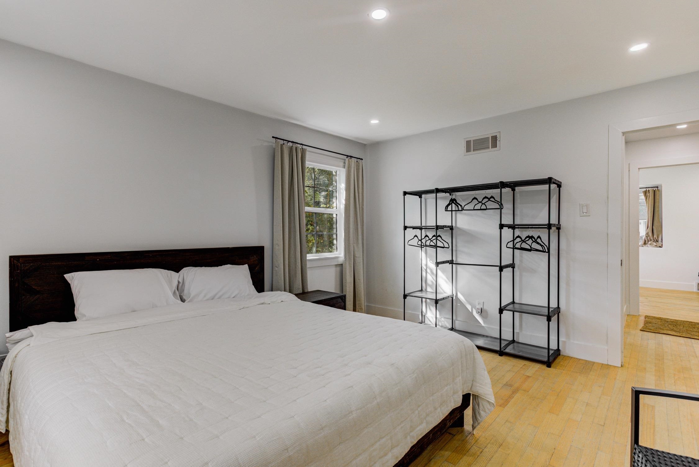 3914 Springfield Drive Memphis, TN 38128 - Photo 22 of 33 a bedroom with a large bed and white walls