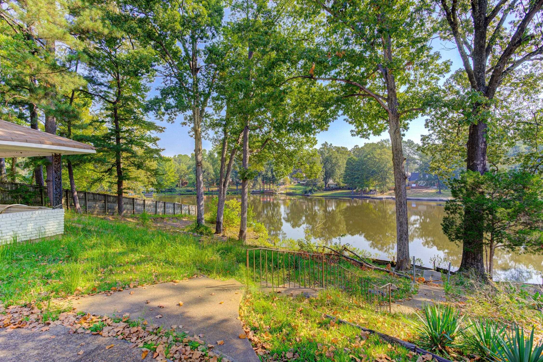 3914 Springfield Drive Memphis, TN 38128 - Photo 29 of 33 a backyard of a house with lots of green space and fountain
