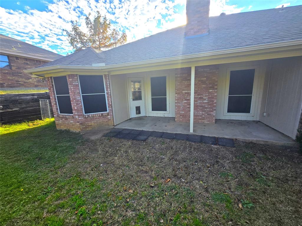 604 Valleyridge Court Decatur, TX 76234 - Photo 26 of 35 a view of house with backyard and porch