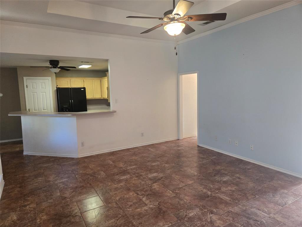 604 Valleyridge Court Decatur, TX 76234 - Photo 33 of 35 en empty room with a fan and a window