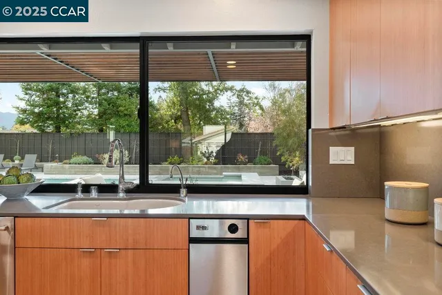 a view of a dining room with furniture and window