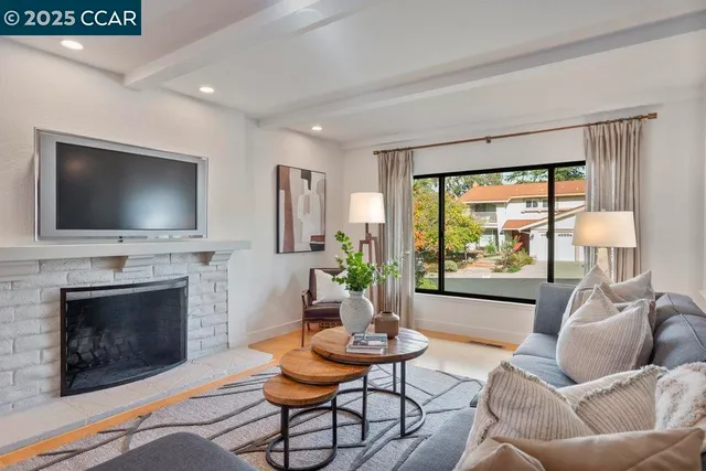 a spacious bedroom with a large bed and a large window