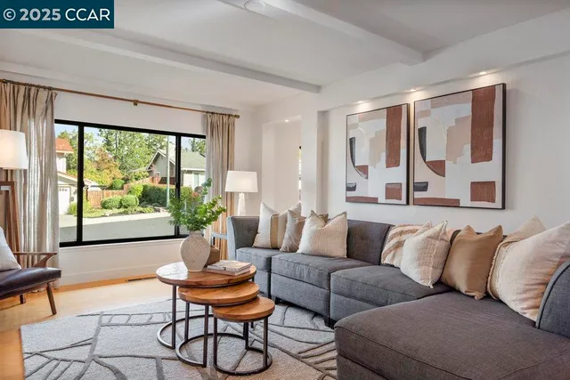 a bedroom with a bed and glass door